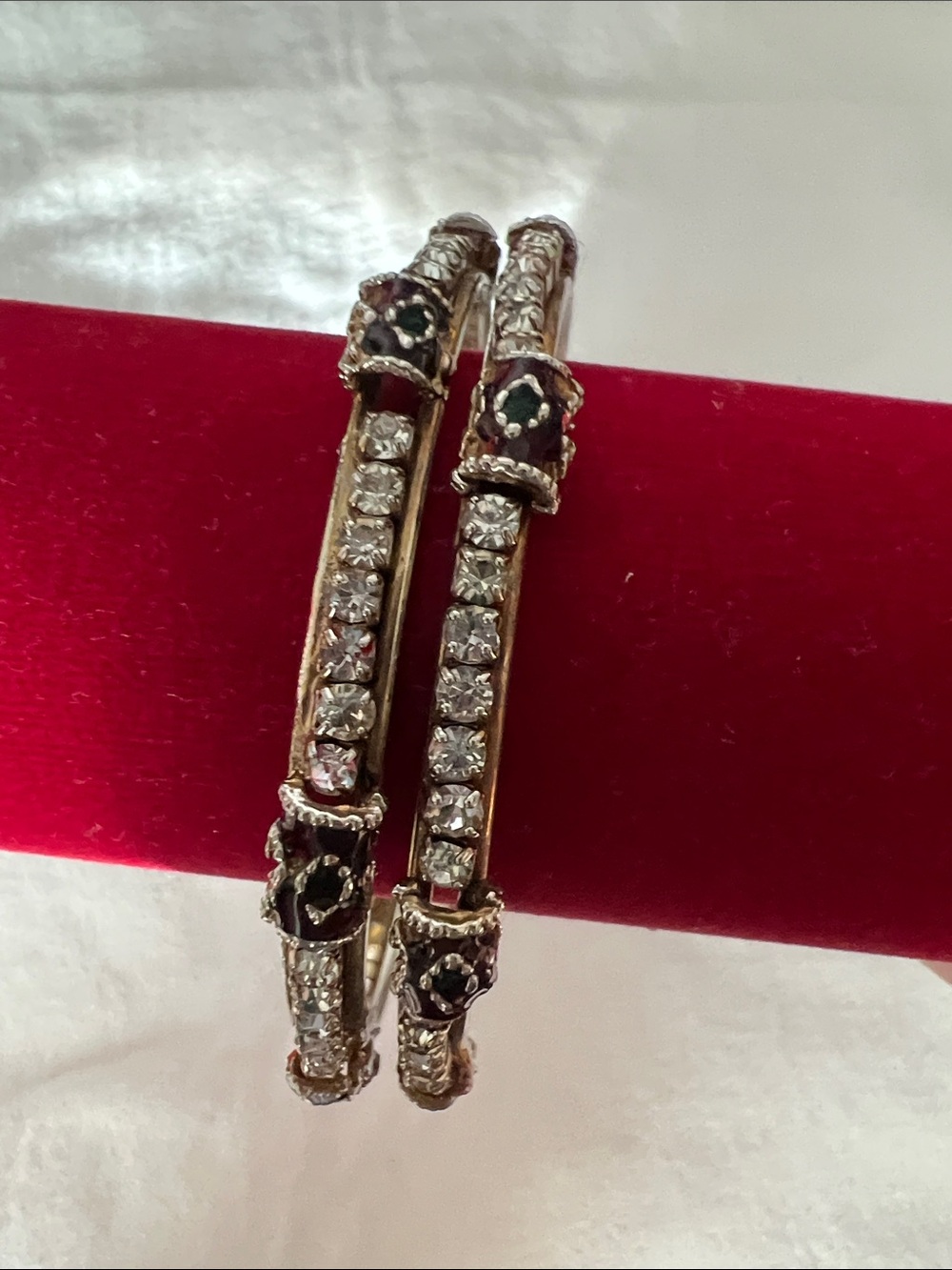 Gold-Tone Crystal Accent Hinged Bracelet — Black Enamel Details